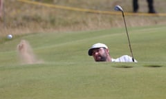 Scottie Scheffler plays a bunker shot