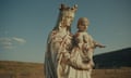 a statue of Mary and Baby Jesus looks over St Joseph's Mission, a former Indian residential school near Williams Lake, British Columbia.