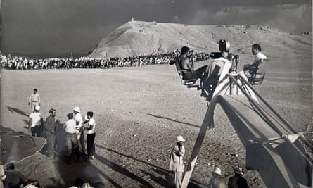 Norman Spencer, bottom of the camera tower in white, with David Lean, seated top right, while filming Lawrence of Arabia in Morocco