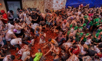 Revellers throw tomatoes at each other during the Tomatina fiesta in the village of Bunol.