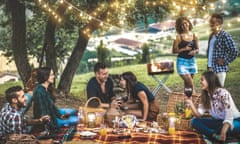 Happy friends having fun at vineyard after sunset - Young people millennial camping at open air picnic under bulb lights - Youth friendship concept with young people drinking wine at barbecue party