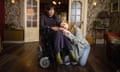 Kyla Harris seated in a wheelchair as Freya and Elena Saurel as Jo, kneeling beside the wheelchair, her head on Harris's lap in We Might Regret This.