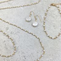 If you love wearing Pearls, you should consider owning this rosary style set.This 40" long necklace can be worn long or doubled to drape elegantly with any of your other favorite pieces or worn color. Versatile is the name of this piece and you w...