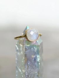 This exquisite aesthetic hand-hammered rainbow moonstone ring captures the essence of timeless elegance. Known for boosting intuition and accessing inner magic, the moonstone resonates with feminine energy, blending intuition, wisdom, and emotional well-being. This enchanting crystal elevates energy, aids in releasing what no longer serves you, and enhances manifesting practices. With strong connections to the higher chakras, it opens communication, creativity, insight, and spiritual connection. Crafted from 925 sterling silver and plated with 18k gold, the hypoallergenic ring ensures lasting beauty. Embrace the magic of this authentic gemstone, perfect for adding a touch of ethereal charm to any ensemble.