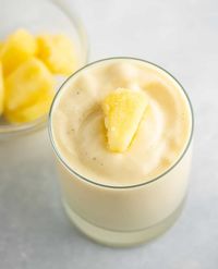 The best frosty 4 ingredient pineapple smoothie. Tastes like a sweet dessert and is made with just 4 ingredients - bananas, pineapple, yogurt, and milk.