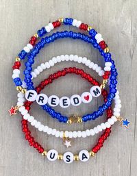 USA Seed Bead Bracelets ❤️🤍💙 Red, White and Cute, these bracelets will be perfect for the holiday and for any occasion supporting the USA. Gold filled beads for no tarnish! Sold separately or as a set Made with 6mm seed beads and gold star charms *Please add bracelet selection in Personalization section if getting multiple bracelets* CARING TIPS FOR YOUR JEWELRY ⭐️Treat and store with care. ⭐️ For longevity, avoid exposing your jewelry to water. ⭐️ Avoid having direct contact with lotions, perfumes, sanitizers as these chemicals may cause discoloration of your jewelry.