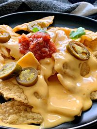 Easy 4 Ingredient Cheese Sauce! Creamy homemade cheese sauce in 5 minutes for topping veggies, baked potatoes or nachos and cheese fries.