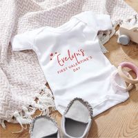 This super cute babygrow makes the perfect gift for a Baby's First Valentine's Day.Celebrate Valentine's Day with our baby grow and personalise the message to include your family and a message such as My first Valentine's Day or Happy Valentine's Day!Made with love in our sunny Sussex-based studio, each baby grow or t-shirt is individually placed in a white cardboard box, ready for gifting.A gorgeous and keepsake and make your partner smile with our adorable First Valentine's day babygrow.Person