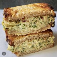 It’s picnic season and I have the best sandwich for you! I posted this on Instagram a while back, and it was super popular. It’s chopped artichoke salad on toast!