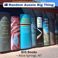 📚 BIG Books 📚 - Alice Springs, NT  Outside the entrance to the Alice Springs Public Library is a set of Big Books.   All eight of the giant books are by the author Neville Shute, who wrote the book A Town Like Alice, which was later adapted into a film.  The locals weren’t too pleased about having the spines of books by an author who wrote about a town ‘like’ Alice, but not actually about Alice Springs itself. Rightfully so.