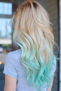 Golden blonde transitioning to pastel turquoise for a sunny to sea ombre, blending the warmth of sunlight with the coolness of ocean hues for a vibrant effect.