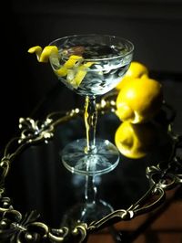 2 oz. (¼ cup) London dry gin   1 oz. (2 Tbsp.) vodka   ½ oz. (1 Tbsp.) Lillet Blanc (or substitute Cocchi Americano or another blanc or bianco vermouth)   Lemon twist, for garnish