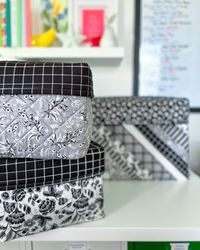 Every fabric enthusiast has faced the storage struggle, and Kelly @bykellyrenay is on the blog with the solution! 🖤

These sophisticated storage boxes are made with the exquisite florals, classic plaids and delicate calico prints of the Midnight Meadows collection by My Mind's Eye! These boxes are perfect for storing fabric scraps and fat quarters!

Visit the blog to see how Kelly pieced together her quilted storage boxes, and don't miss Midnight Meadows in shops now!