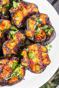 Eggplant lovers will rave about this grilled eggplant recipe with a sweet and tangy glaze. The beautiful bold colors make this an impressive side dish for any BBQ or picnic. #grilledeggplantrecipes