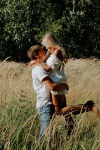 Country couples pic wearing white in field