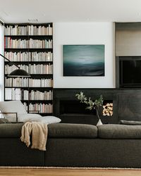 Living Room with Cold Rolled Steel Fireplace + Bookcase and Modern Furniture