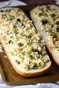 This Olive Cheese Bread is an easy and delicious appetizer with salty olives, gooey cheese, and crunchy bread. Crazy good! #olivebread #olivecheesebread