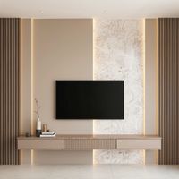 A beige wall with a subtle white granite pattern. On one side of the wall, there are vertical wooden slats. In the center of the wall, there's a sleek, large flat-screen TV mounted on the wall. Below the TV, there's a minimalist wooden TV console with a few modern décor items. There's soft LED lighting behind the TV and along the edges of the wood accents. The lighting creates a warm, ambient glow.#livingroomfurniture #livingroomdecorideas #homedecorlivingroom #homedecorating