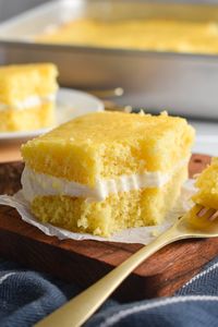 This layered Twinkie Cake starts with a yellow cake mix and is filled with a fluffy, creamy, not-too-sweet vanilla filling!