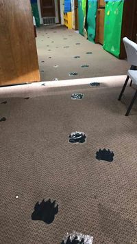 VBS camp out theme Bear tracks and deer tracks cut out and taped to floor