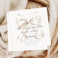 "She's tying the knot" theme bridal shower invitation with an elegant white bow design.