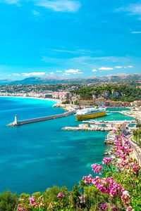 Beautiful views of Nice port with flowers in background. This is one place you can't miss on your South of France itinerary! #provence #nice #france