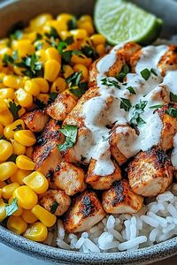 Enjoy this easy Street Corn Chicken Rice Bowl recipe, packed with grilled corn, seasoned chicken, and cilantro lime rice for a healthy,