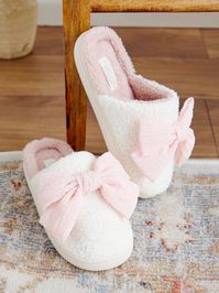 These slippers are the perfect companion for cozy nights in. The oversized bow adds a touch of playful charm, a reminder to embrace the little joys in life. The luxuriously soft material feels like walking on clouds.