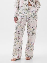 Soft cotton poplin PJ pant.  Elasticized waist with drawstring.  Front slant pockets.  Allover print.  Straight silhouette with a relaxed fit.  Easy through the hip and thigh.  Models wearing Gap