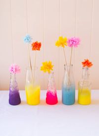 A UK wedding blog covering real weddings with high quality wedding photography, Wedding Diy's and Wedding planning advice. A simple diy tutorial for spray painting ombre neon bottles as an alternative centrepiece idea.