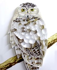 A commissioned quilling of an owl, made completely out of paper.