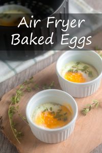 Air Fryer Baked Eggs cooked in ramekins make for a tasty, time-saving breakfast! #airfryer #eggs #bakedeggs #breakfast #brunch via @cookthestory