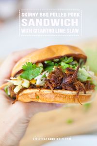 The most flavorful, smokey Instant Pot pulled pork makes for the best skinny pulled pork sandwich with this fresh and healthy cilantro lime slaw on top. #lillieeatsandtells #lillielovesmacros #macrofriendly #macrofriendlyrecipes #healthyrecipes #pulledpork #weightwatchersrecipes www.lillieeatsandtells.com