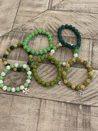 Don't forget your green this St. Patrick's Day!  This listing is for one beaded bracelet in the style of your choice. Beads are 10MM in size.  Typically, each some with 20 beads, but when alternating more than more than 2 colors there may be more or less. Bracelet is made on stretch string, so they are expandable to fit most wrist sizes. Each bracelet comes with a shamrock charm of you choice from the list below.  Refer to pictures for visual.  If you would like a different colors or options, pl