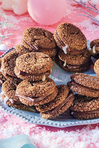 One of the best dessert experiences of recipe developer Camilla Wynne's youth was eating these sandwiches—two fudgy cookies bonded together by a melted After Eight—cold from her aunt’s freezer. This ginger-spiked version is even more festive than the original.