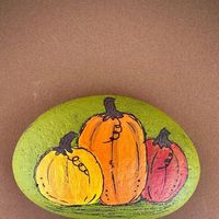 Rock’n&RV’n - Rock Artist on the Road on Instagram: "Pumpkins painted rock @rockin.andrvin #pumpkinspaintedonrock #pumpkinseason #paintedpumpkins #paintedpumpkins🎃🎨 #paintedpebbles #rockpainting #fallpaintedrocks"