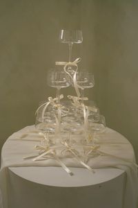 Champagne tower with bows #champagne #champagnetower #champagneweddingtower #weddingideas #weddingdecor