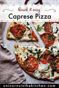 Caprese pizza is an easy dinner ready in 30 minutes. Made with homemade basil oil, tomatoes and mozzarella, this pizza is a crowd pleaser. Watch the video for a complete tutorial. #tomatoes #caprese #capresepizza #pizza #pizzarecipes #dinnerideas