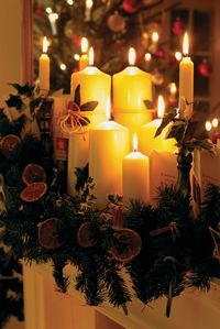 Candles and Christmas Decorations on a Mantelpiece