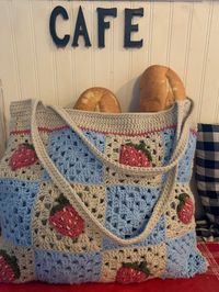 Handmade Crochet Tote Bag with Granny Squares and Custom Pattern Appliques  Pictured with Strawberry Appliques, Blue and Cream Granny Squares, and Blue Lining  Choose any colors, appliques, and lining as well as strap color and  Durable Hand-Stitched Lining (holds textbooks and more)