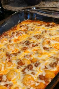 Gnocchi Bake | "A quick and easy blend of gnocchi, sausage, cheese, and your favorite spaghetti sauce baked together for a hearty casserole." #dinnerideas #dinnerrecipes #dinnerdishes #familydinnerideas #casserole #casserolerecipes #hotdish