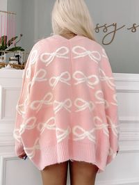 Cozy up in style with our Bow My Way Cardigan from Sassy Shortcake. This oversized cardigan features a playful pink hue and a charming bow detail, making it the perfect addition to any outfit. Stay warm and on-trend with this must-have piece. fit: oversized (model wearing a size small) content: 60% acrylic 20% chinlon 20% polyester care: hand wash cold