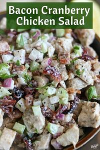 Bacon Cranberry Chicken Salad is a kicked-up version of the classic. With thick-cut bacon, plump cranberries, and homemade dressing, this easy chicken salad recipe is delicious on its own, in a sandwich or as a side #bacon #cranberries #celery #chicken #poachedchicken #chickensalad #summerrecipe