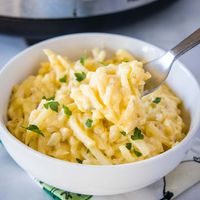 Crockpot Hashbrown Casserole - classic cheesy potato casserole made in the crockpot. Super simple, frees up the oven and makes dinner time easy! 