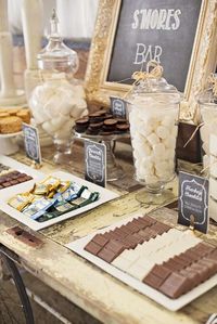 Dessert table at a s'mores themed 40th birthday party! See more party planning ideas at CatchMyParty.com!