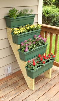 Here's an easy way to add some colorful plants to a small outdoor space by utilizing any vertical area available.