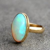 Opal Ring  Opal Gold Ring  Opal 18 KT Solid Gold Ring by lsueszabo  Sometimes the simplest, most classic settings are perfect to showcase the exceptional beauty and quality of a stone.