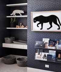 THIS incredible nursery space! Designed by Liberty Interiors. Featuring our Ubabub Clear Acrylic Bookshelves. Black Metallic Dots Wallpaper by Juju Papers. Panther print by Luke Furniture.