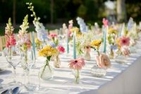 Spring wedding pastel flowers for long dining table. #pastel #pastelflowers #springwedding #weddingtablecenterpieces #delphinium #peonies #brightflowers