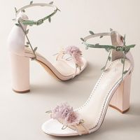 #BellaBelleByYou - Eden was designed, created, and voted by you in our first ever social collaboration campaign. It’s like wearing a beautiful garden of Eden on your feet. It is filled with lush layers of pastel-colored organza flowers in yellow, blush and lavender. The sandal silhouette, coupled with block heels make this shoe the perfect heel for a garden soiree . You can stay secure with the twirling embroidered vines that wrap around the ankle strap. FEATURES: Handmade, extra padding for all